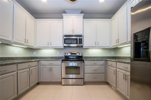 kitchen featuring stainless steel appliances, white cabinetry, gray cabinets, and crown molding