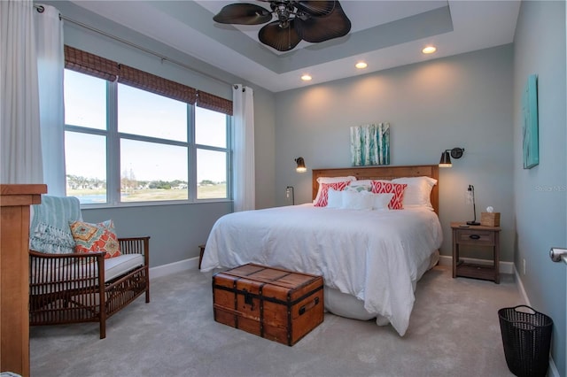 bedroom featuring light carpet and ceiling fan