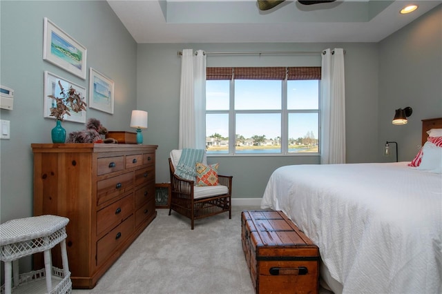 bedroom featuring ceiling fan and light carpet