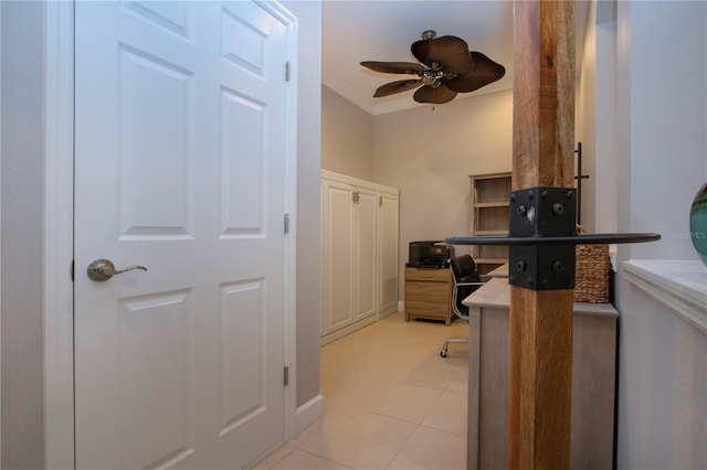 office space with light tile patterned flooring, ornamental molding, and ceiling fan