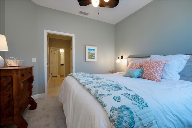 bedroom featuring ceiling fan and light carpet