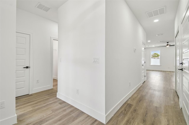 corridor featuring light hardwood / wood-style floors