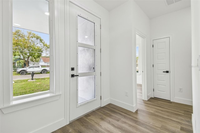 doorway to outside featuring wood-type flooring