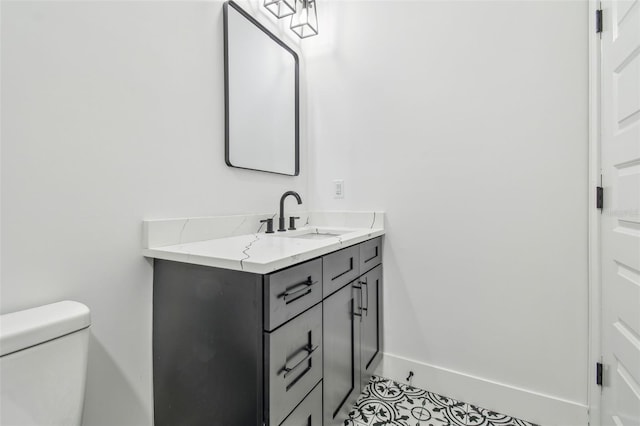 bathroom featuring toilet and vanity