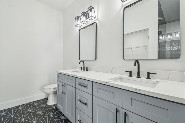 bathroom with toilet and vanity