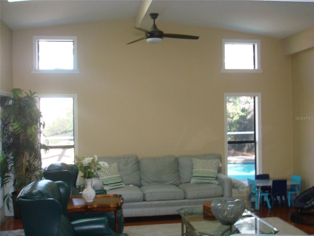 living room featuring hardwood / wood-style flooring and lofted ceiling with beams