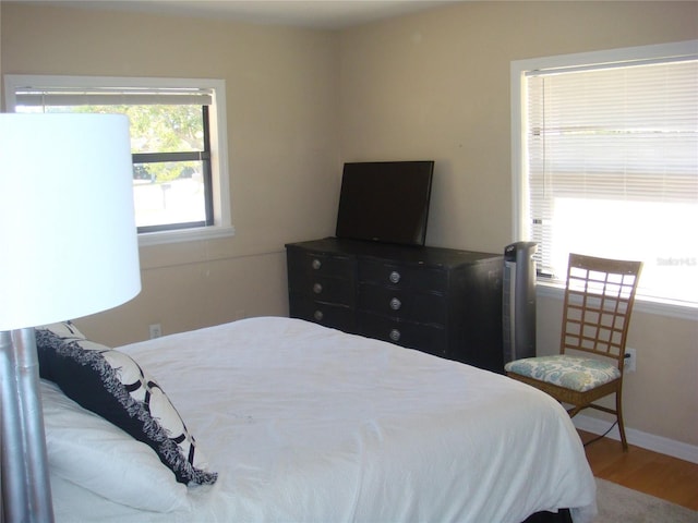 bedroom featuring hardwood / wood-style flooring