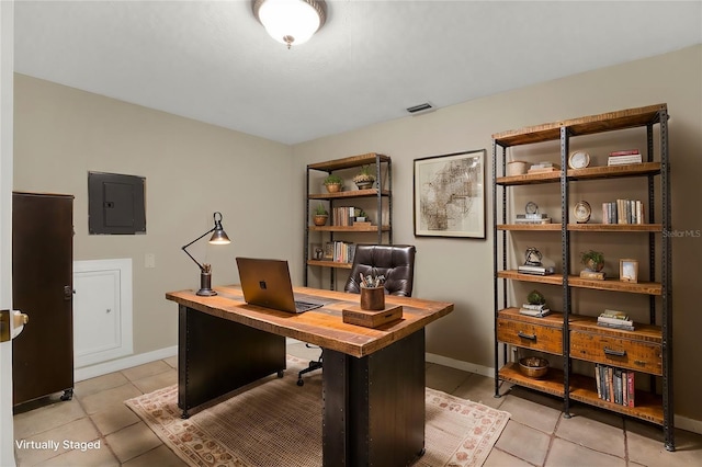 tiled office space with electric panel