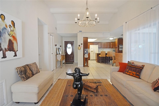 living room featuring vaulted ceiling with beams, a notable chandelier, and light tile patterned floors