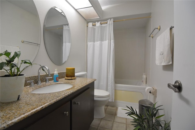 full bathroom featuring shower / tub combo, vanity, tile patterned floors, and toilet