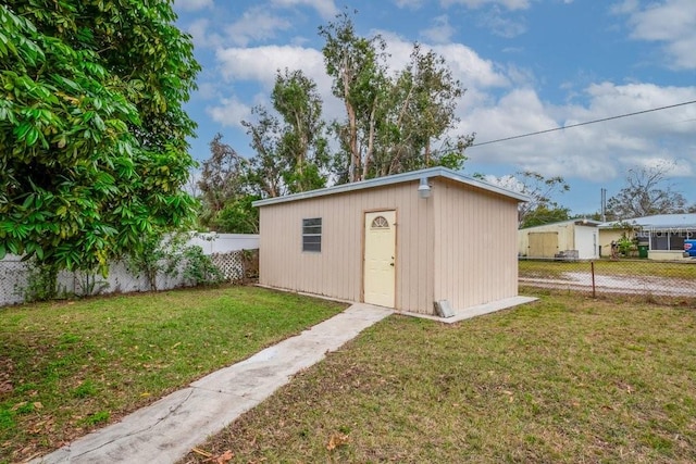 view of outdoor structure featuring a yard