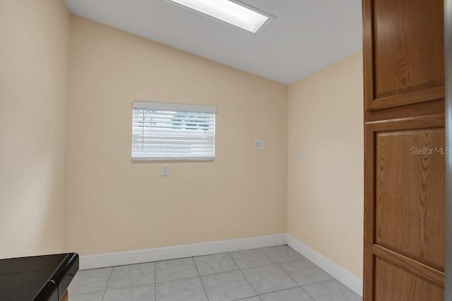 empty room with light tile patterned floors