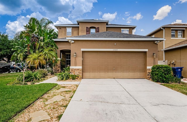 view of front facade with a garage and a front yard