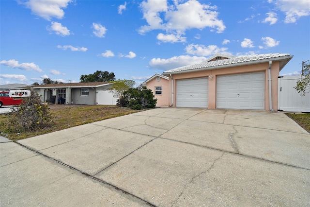 ranch-style home with a garage