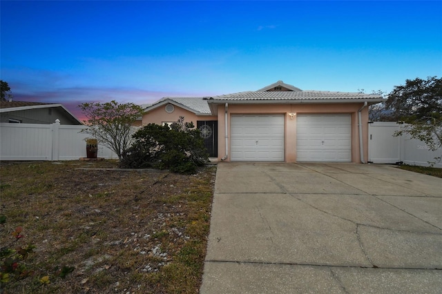 single story home with a garage