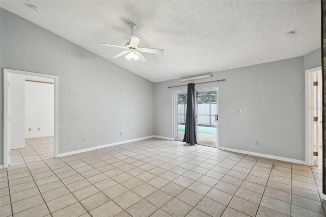 spare room featuring light tile patterned floors, a textured ceiling, vaulted ceiling, and ceiling fan