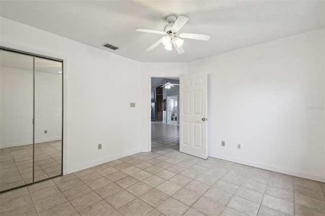 unfurnished bedroom with a closet and ceiling fan