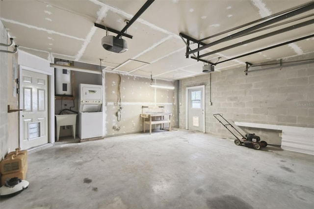 garage with stacked washer and dryer and a garage door opener