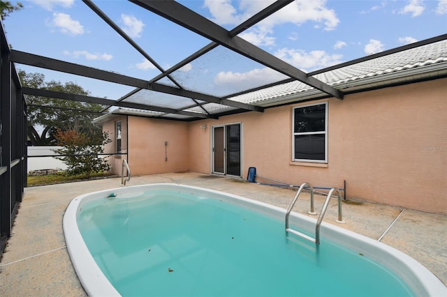 view of pool featuring a patio area and a lanai