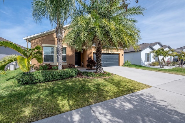 view of front of property with a garage and a front lawn