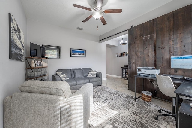 office space with light tile patterned floors and ceiling fan