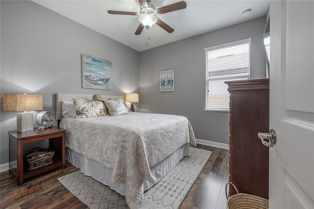 bedroom featuring dark hardwood / wood-style flooring and ceiling fan