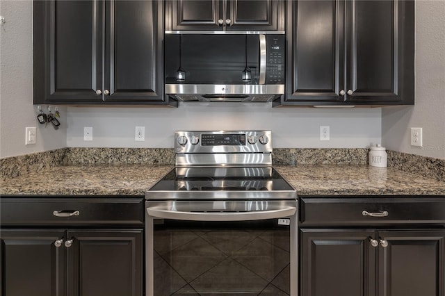 kitchen featuring stainless steel appliances and stone counters