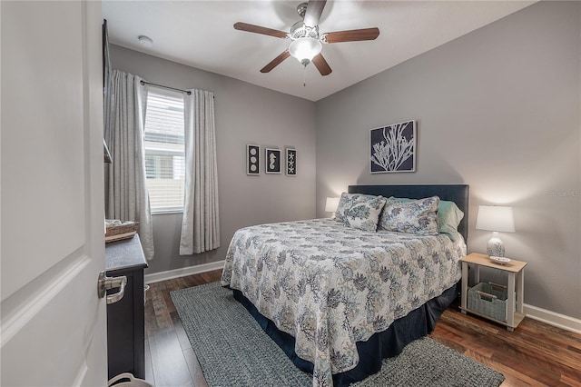 bedroom with dark wood-type flooring and ceiling fan