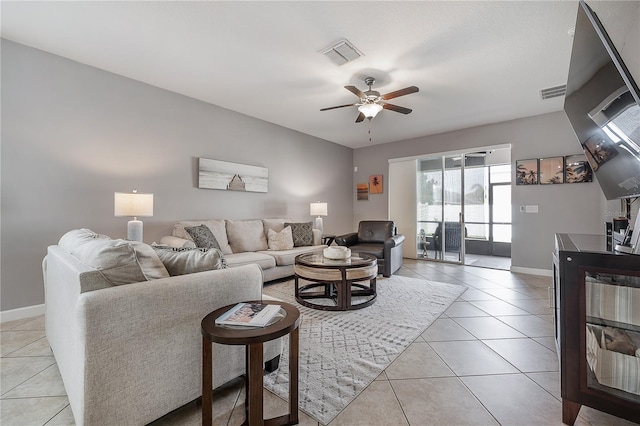 living room with light tile patterned floors and ceiling fan