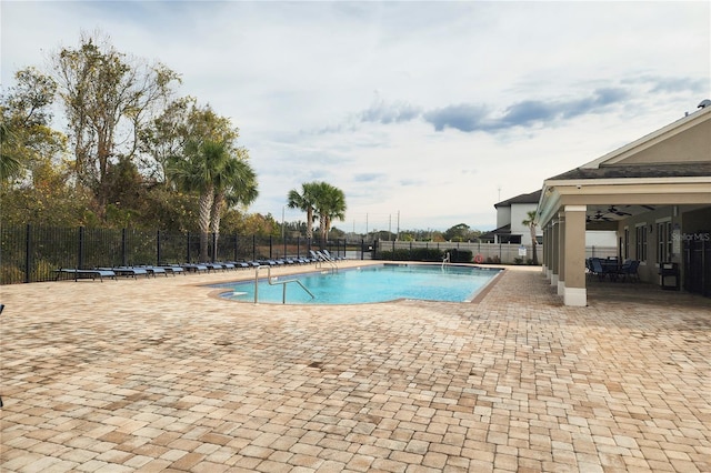 view of pool featuring ceiling fan and a patio area