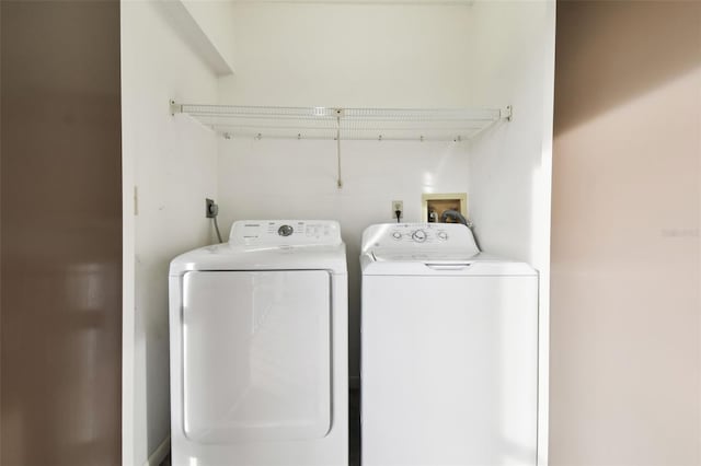 laundry area with washing machine and clothes dryer