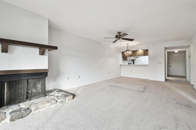 unfurnished living room with carpet, ceiling fan, and a multi sided fireplace