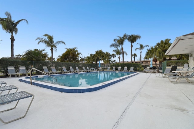 view of swimming pool featuring a patio area