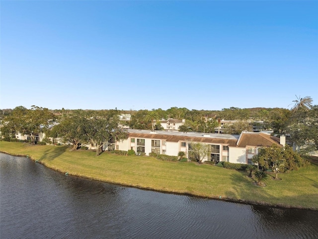 exterior space featuring a water view and a front yard