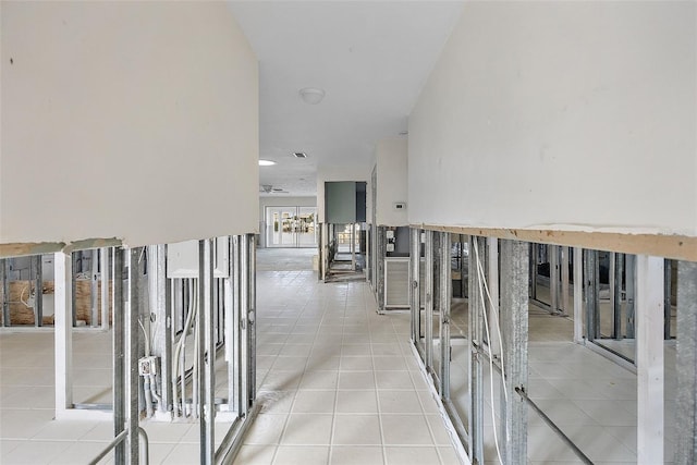 corridor with light tile patterned floors