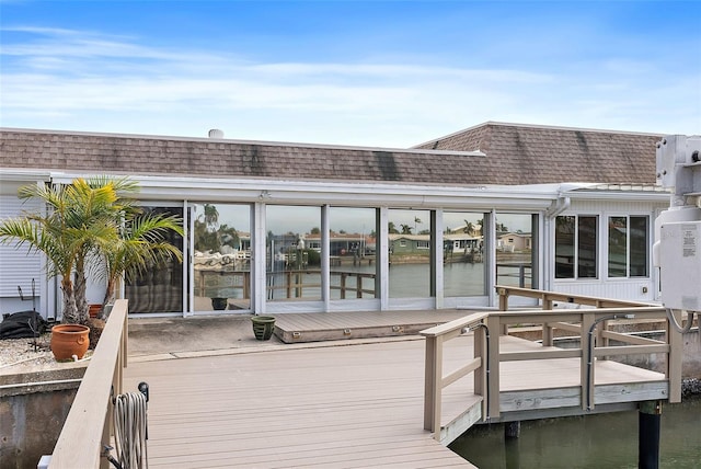 back of house with a water view