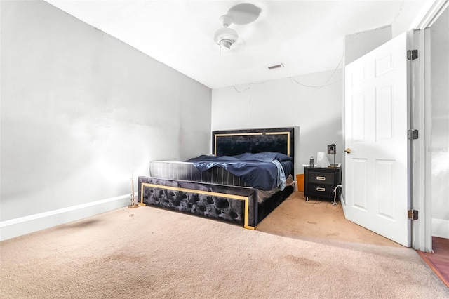 bedroom with ceiling fan and carpet flooring