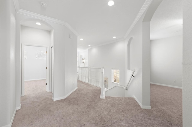 hall featuring crown molding and light colored carpet