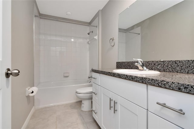 full bathroom with tile patterned flooring, vanity, tiled shower / bath combo, and toilet