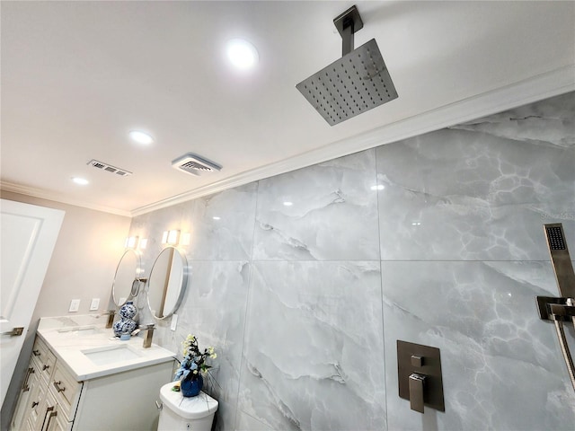 bathroom with toilet, a shower, crown molding, tile walls, and vanity