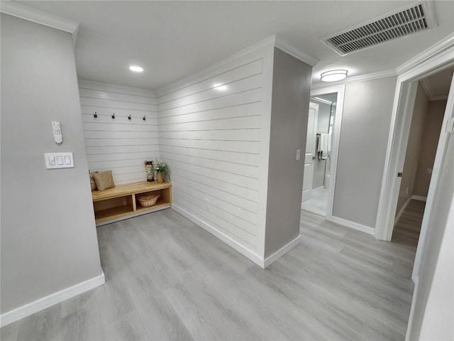 mudroom featuring ornamental molding and light hardwood / wood-style floors