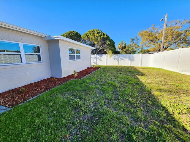 view of yard with a fenced backyard