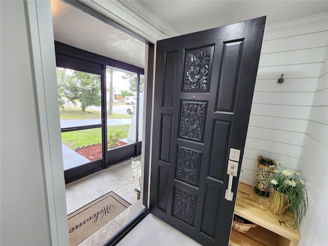 entrance foyer with wood walls