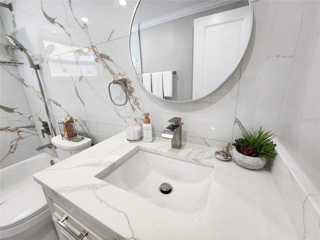 bathroom featuring vanity, crown molding, and toilet