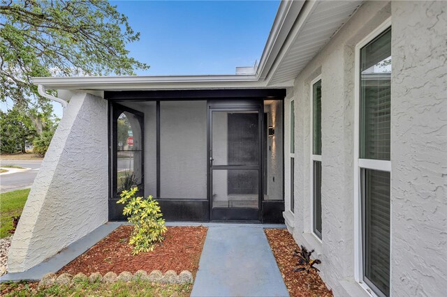 9334 Ledgestone Ln, Port Richey, FL 34668 - doorway to property with stucco siding