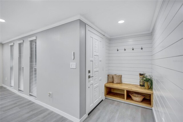 9334 Ledgestone Ln, Port Richey, FL 34668 - mudroom with ornamental molding, baseboards, light wood-type flooring, and recessed lighting