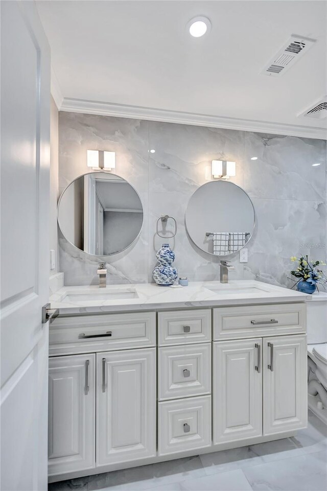 9334 Ledgestone Ln, Port Richey, FL 34668 - bathroom with toilet, crown molding, a sink, and visible vents
