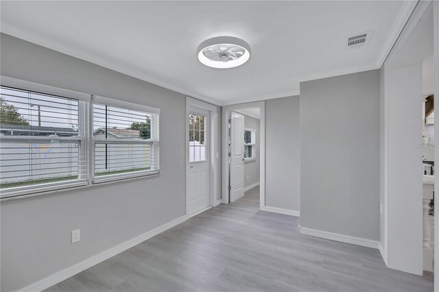 9334 Ledgestone Ln, Port Richey, FL 34668 - spare room featuring visible vents, baseboards, and light wood finished floors