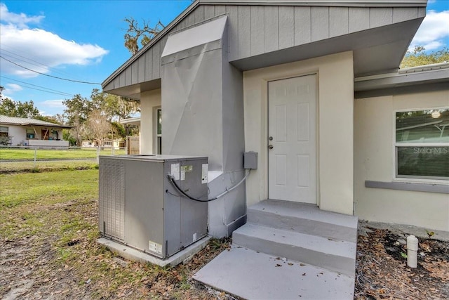 doorway to property with central air condition unit