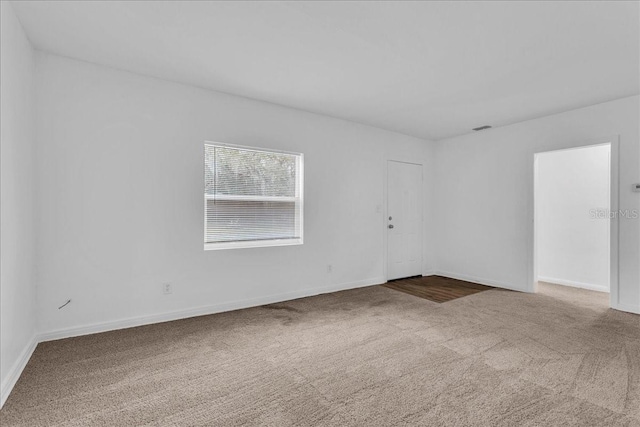 spare room featuring carpet flooring